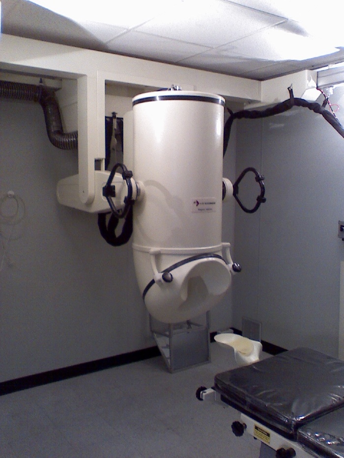 A conventional magnetoencephalography instrument in an empty measurement room.