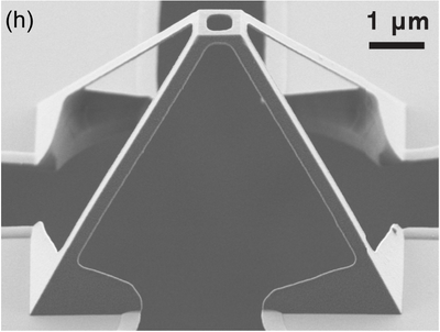 Scanning electron micrograph of a pyramidal wireframe ending in an open square loop; the original 1-micrometre scale bar is visible.