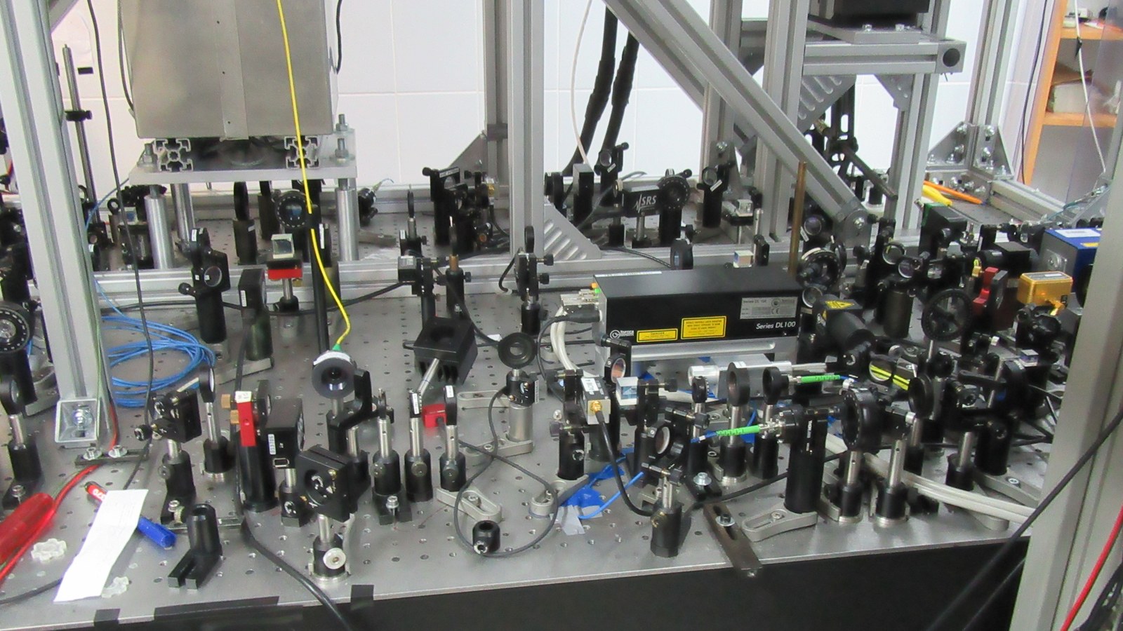 Lasers, mirrors and optical components on an ultracold-atom laboratory table at Nicolaus Copernicus University