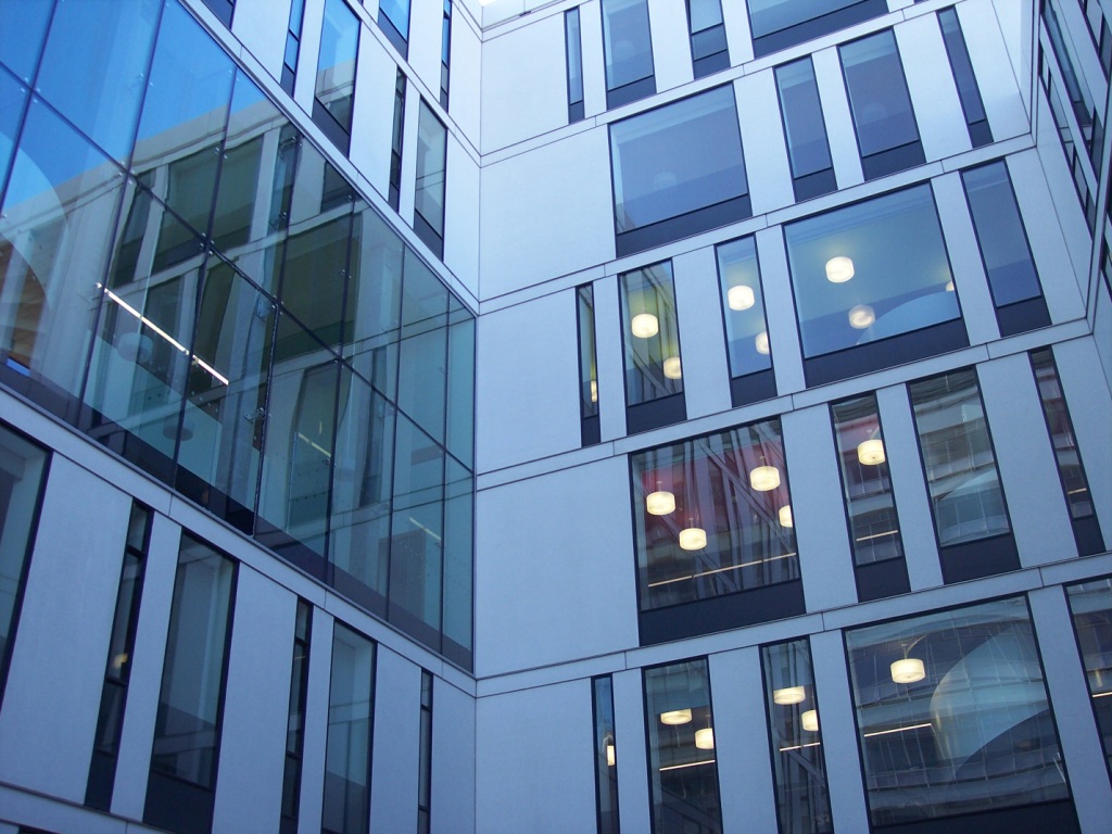 Photograph of the glass-fronted Informatics Forum courtyard at the University of Edinburgh.