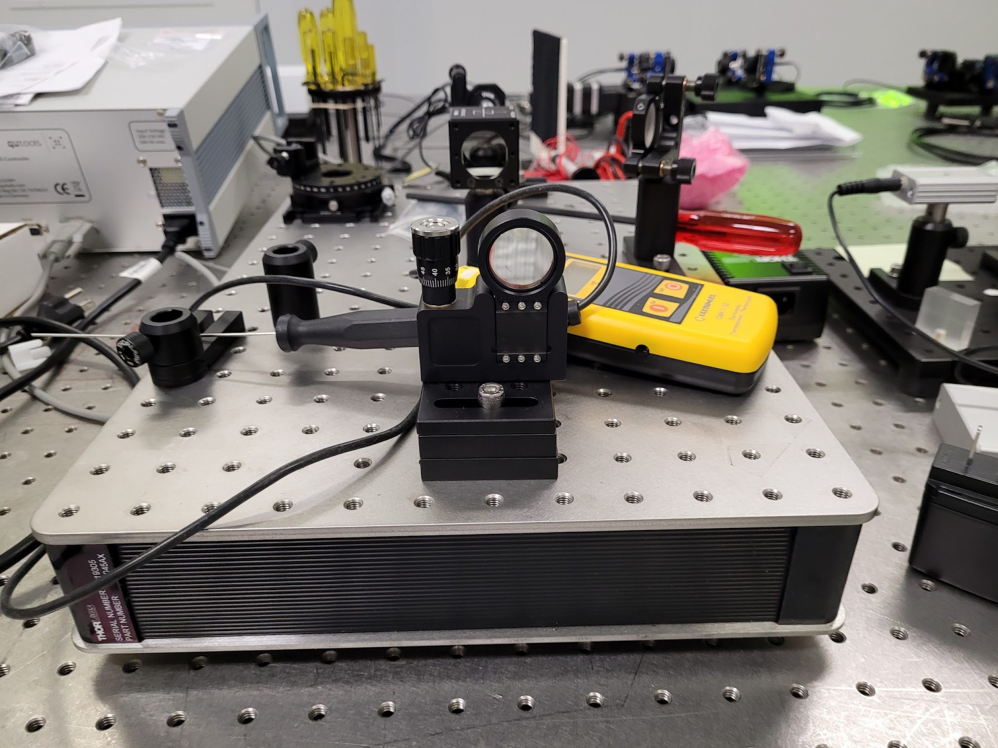 Mirrors and optical components arranged as a Michelson interferometer on a laboratory bench.