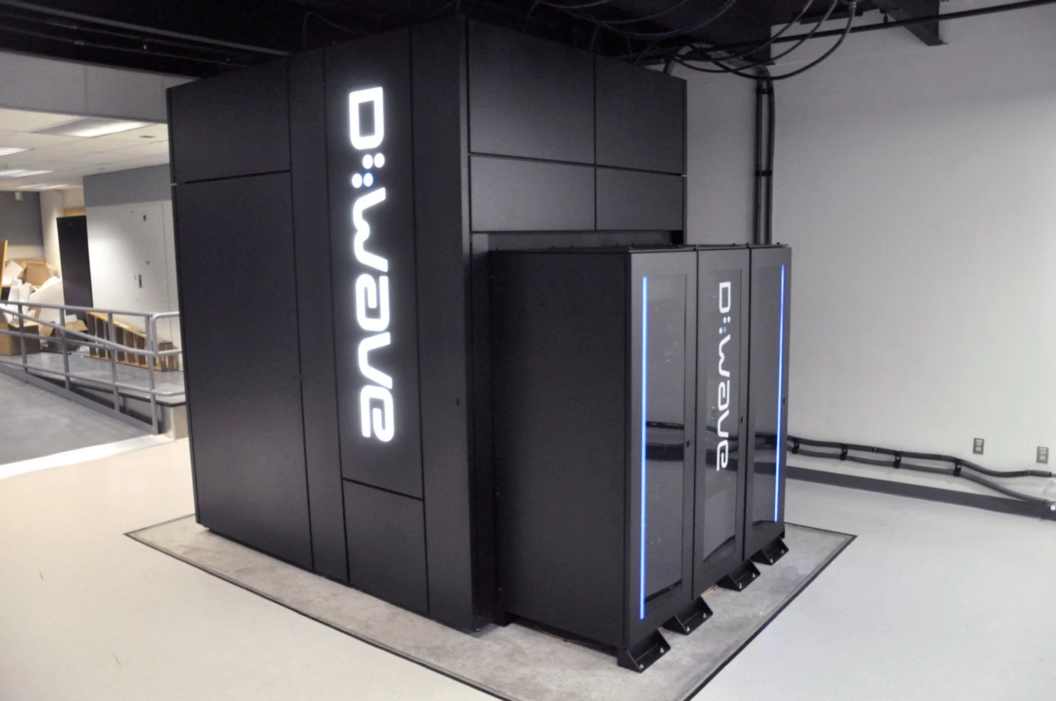 A black D-Wave Two enclosure in a computing facility.