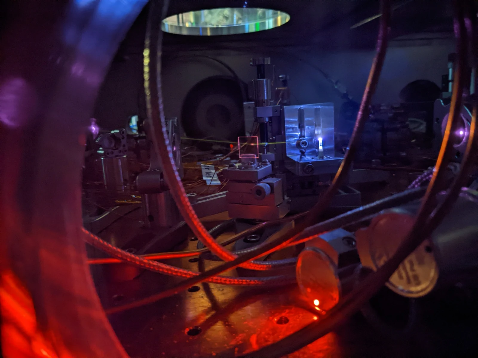 Laser and optical equipment in a dark laboratory used for timing research.