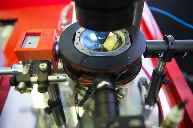 Optical and vacuum components form an atom-interferometer instrument.