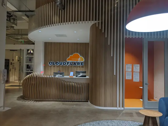 Reception desk with the Cloudflare name and orange cloud symbol.