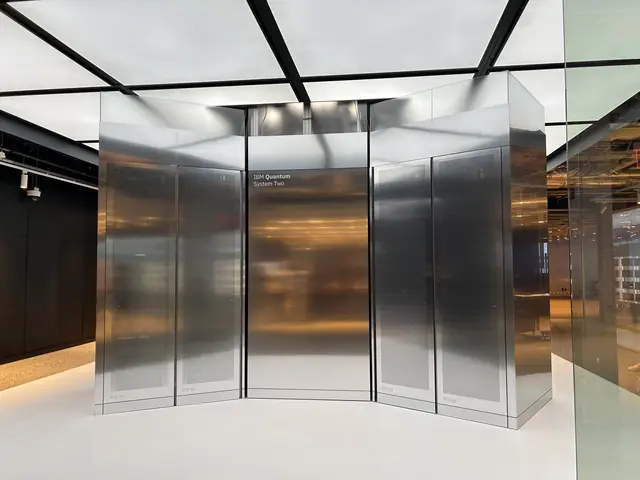 A reflective metal enclosure around IBM computing equipment in a research laboratory.