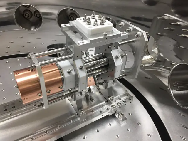 Metal electrodes of a Paul ion trap mounted inside an open vacuum vessel.