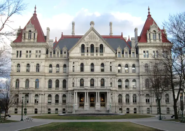The ornate stone facade and red roofs of New York’s State Capitol.