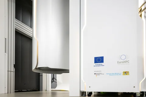 A pale curved enclosure and adjacent panel carry European Union and EuroHPC markings.
