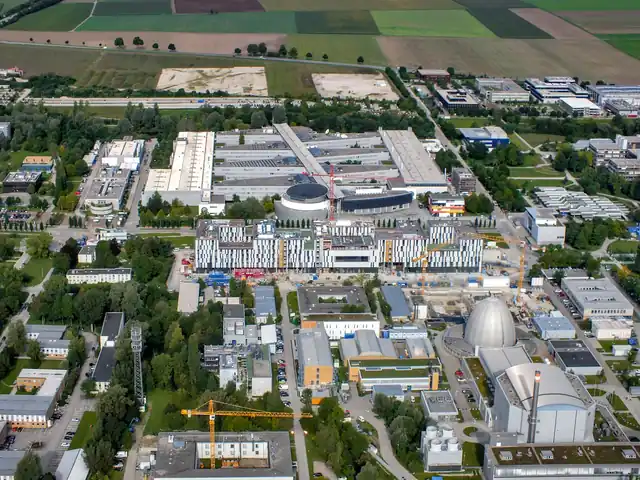 Aerial view of the TUM research campus in Garching with the Galileo Centre under construction.