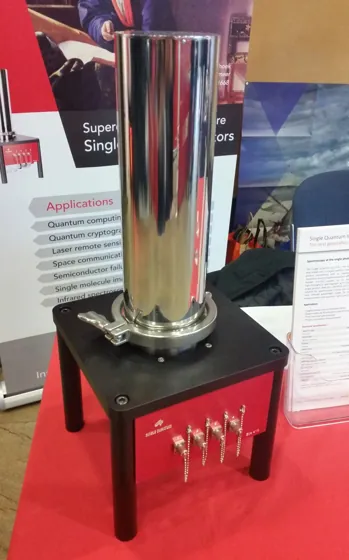 A Single Quantum photon-detector display with a cylindrical module above a red connection panel.
