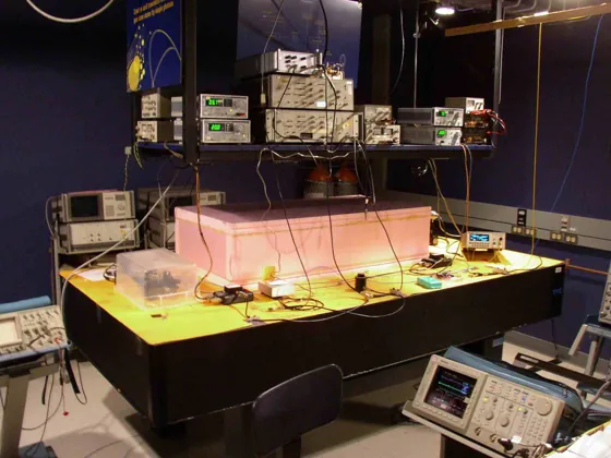 An optical laboratory table with instruments mounted above it, forming the historical Alice network node.